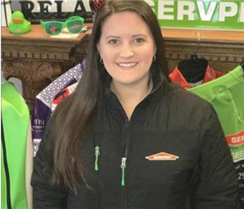 Office Manager, Holly Lee, standing in her SERVPRO gear.