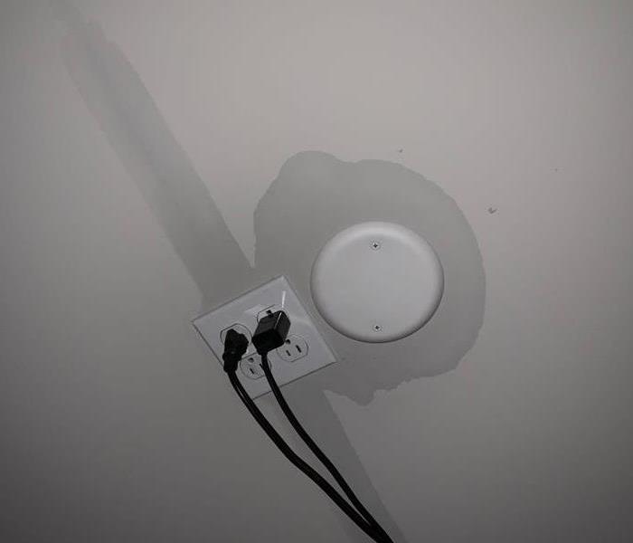 water damage seeping through ceiling around electrical outlets