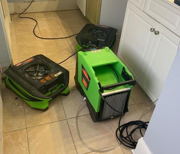 Bathroom with SERVPRO equipment set to begin drying process