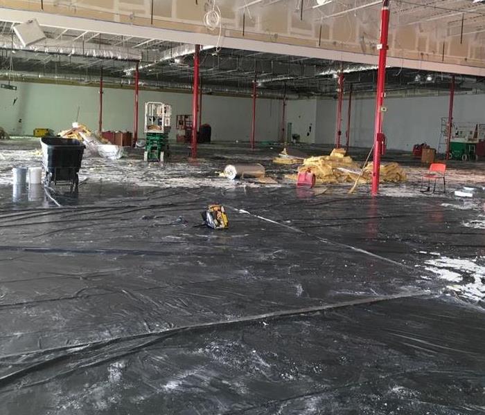 Large Anderson warehouse suffers water damage to tile covered in black tarp