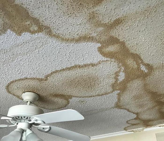 Water stains on ceiling from burst pipe